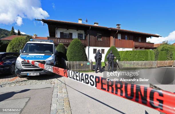 Police stand outside a Tegernsee lakeside villa of Russian oligarch Alisher Usmanov during a police raid on September 21, 2022 in Rottach-Egern,...