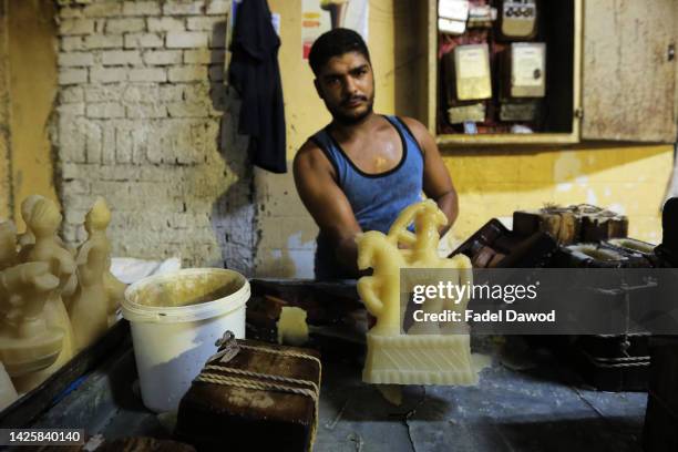 Eslam An Egyptian factory worker forms candy dolls in preparation for the upcoming Mawlid celebrations , at a traditional factory in Bab al-Bahr...