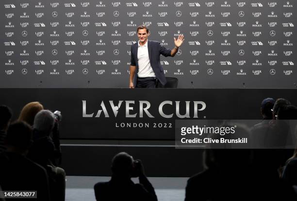 Roger Federer of Team Europe waves to the media asduring a press conference ahead of the Laver Cup at The O2 Arena on September 21, 2022 in London,...