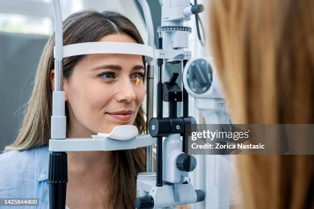 look at the light - eye doctor stock pictures, royalty-free photos & images