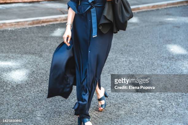 low section elegant fashionable woman walking at the street - blue skirt stockfoto's en -beelden