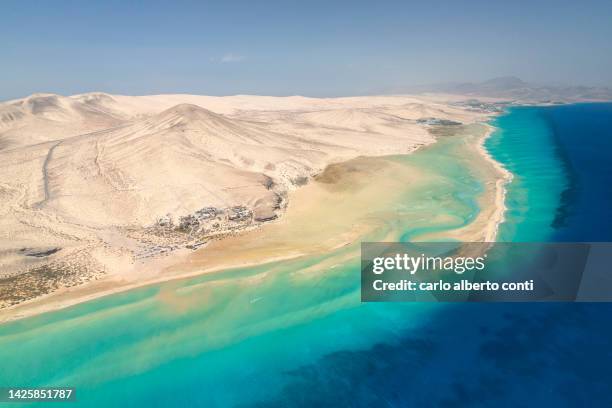 aerial view taken by drone of a beautiful beach of sotavento, fuerteventura, canary island, spain europe - paisaje volcánico fotografías e imágenes de stock