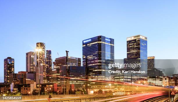 an elevated view of the canary wharf skyline, london - dusk - canary wharf fotografías e imágenes de stock