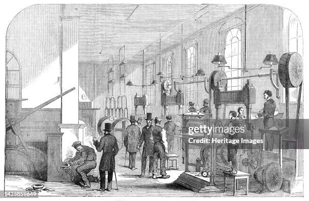 The Bank-Note Printing-Room, at the Bank of England [in London], 1854. 'The quality and the water-mark of the...paper have in the new Note been...