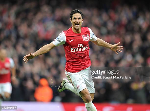 Mikel Arteta of Arsenal celebrates scoring during the Barclays Premier League match between Arsenal and Manchester City at Emirates Stadium on April...
