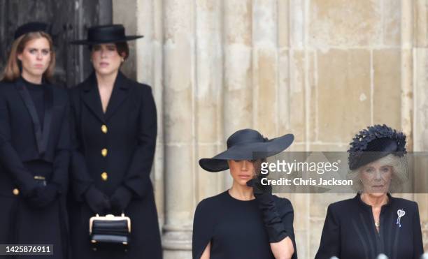 Meghan, Duchess of Sussex and Camilla, Queen Consort are seen during The State Funeral Of Queen Elizabeth II at Westminster Abbey on September 19,...