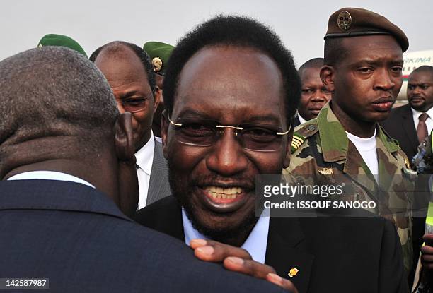 Malian Parliament Speaker Dioncounda Traore is greeted by Malian deputies on April 7, 2012 upon his arrival at the Bamako airport from Burkina Faso....