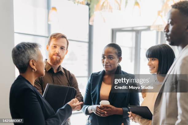 female leader, manager or ceo in a meeting with her corporate team for planning, strategy and learning. leadership, management and mentorship with a woman boss and her staff talking in the office - community organization stock pictures, royalty-free photos & images