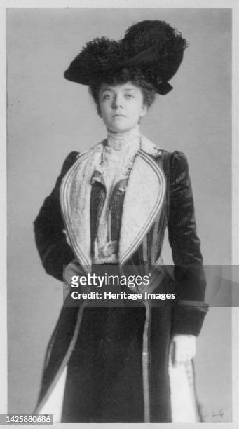 Mrs. Alice Roosevelt Longworth, three-quarter length portrait, standing with right hand on hip, wearing coat and hat, circa 1902. [Daughter of...
