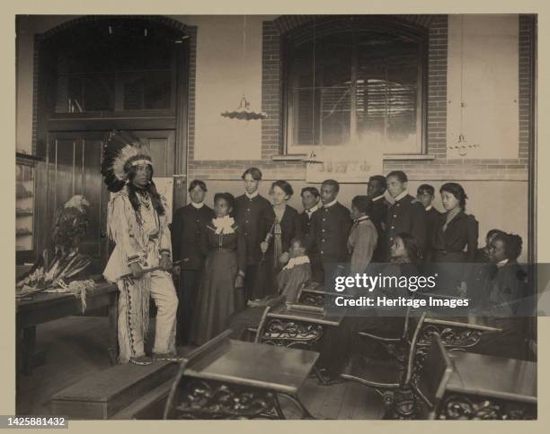 Louis Firetail , wearing tribal clothing, in American history class, Hampton Institute, Hampton, Virginia, 1899 or 1900. Artist Frances Benjamin...