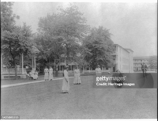 Women student activities - playing croquet, Carlisle Indian School, Carlisle, Pennsylvania, 1901. Boarding school for Native American students,...