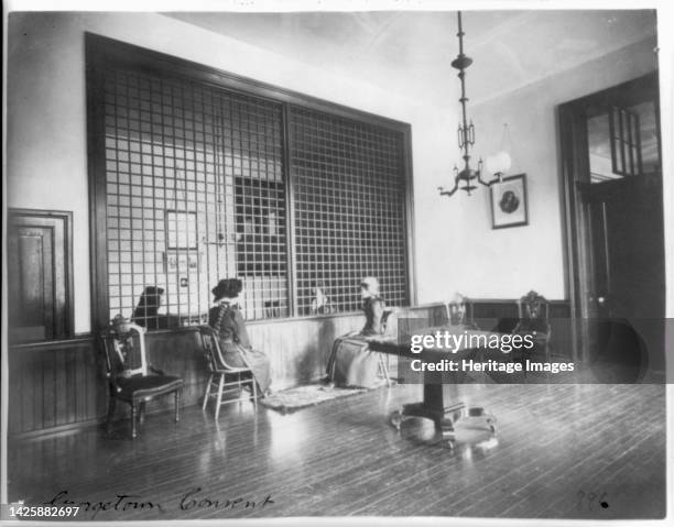 Georgetown Convent, Washington, D.C., between 1890 and 1910. [Pupils and nuns either side of a grille at Georgetown Visitation Preparatory School, a...