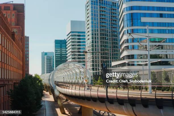 railway through downtown district in the hague - the hague summer stock pictures, royalty-free photos & images