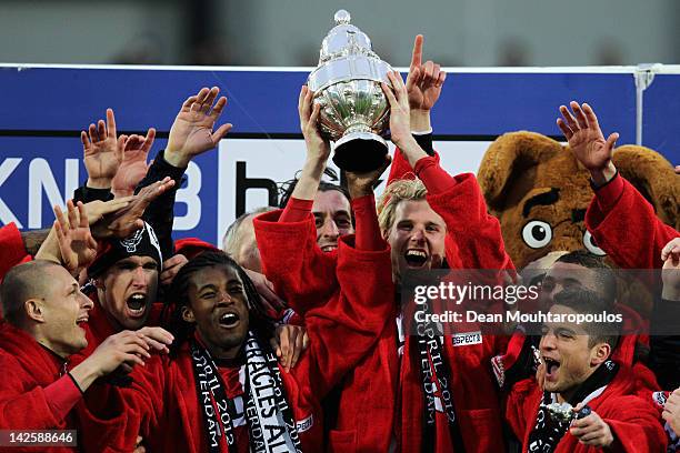 Captain, Ola Toivonen of PSV leads celebrations with the trophy after victory in the Dutch Cup Final between PSV Eindhoven and SC Heracles Almelo at...