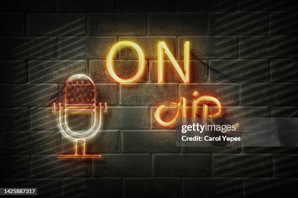 on air red neon light on black wall - on air microphone stock pictures, royalty-free photos & images