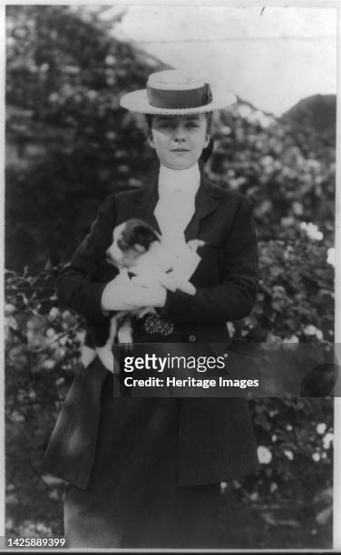 Alice Roosevelt in riding clothes, with dog, circa 1902 June 17. [Daughter of President Theodore Roosevelt and his first wife Alice Hathaway Lee]....