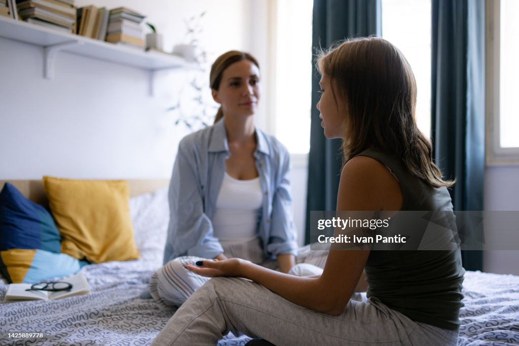 Mother and daughter talking at home