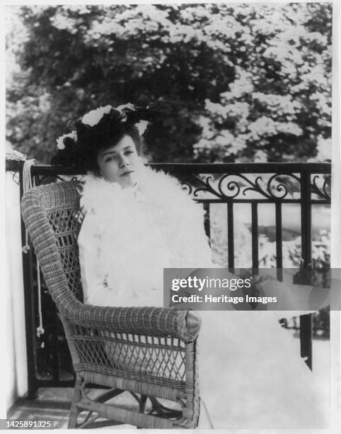 Alice Roosevelt Longworth, between circa 1890 and circa 1910. Full length portrait, seated in wicker chair, facing right. [Daughter of President...