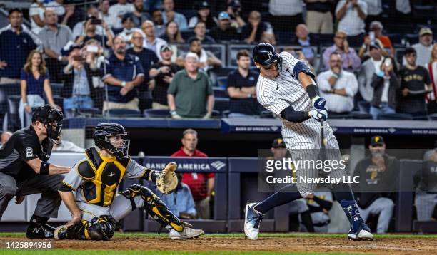 New York Yankee Aaron Judge hitting his 60th home run of the season in the bottom of the 9th inning against the Pittsburgh Pirates at Yankee Stadium,...