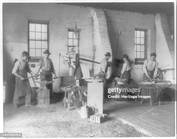 Pa. - Carlisle Indian School - student wheelwrights working in shop, 1901. Artist Frances Benjamin Johnston.