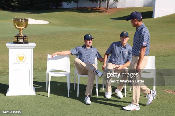Collin Morikawa of the United States Team arrives as Justin Thomas and Jordan Spieth of the United States Team look on before the team photo prior to...