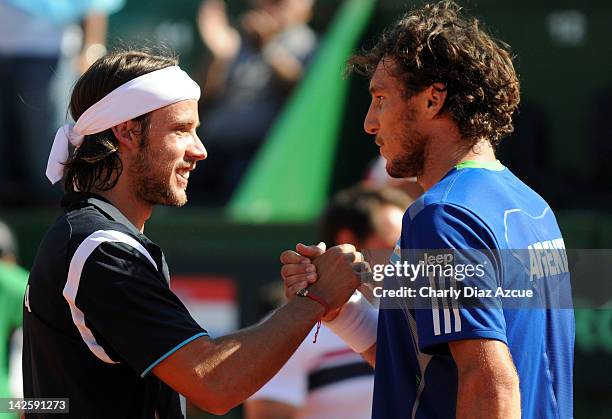 Juan Monaco of Argentina salutes Antonio Veic of Croatia after the match between Argentina and Croatia for the quarterfinals of the Davis Cup at Mary...