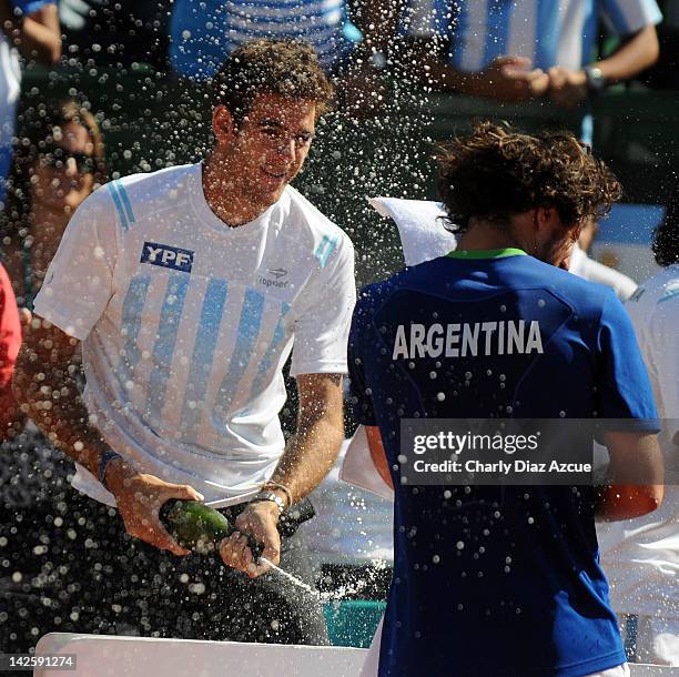 Juan Martin Del Potro celebrates with teammate Juan Monaco after the match between Argentina and Croatia for the quarterfinals of the Davis Cup at...
