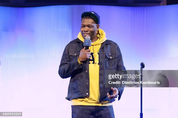 Michael Che speaks onstage during NRDC's "Night of Comedy", Honoring Anna Scott Carter, Presented In Partnership With Warner Bros. Discovery on...