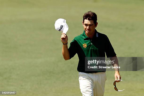 Louis Oosthuizen of South Africa smiles after making an albatross on the second hole during the final round of the 2012 Masters Tournament at Augusta...
