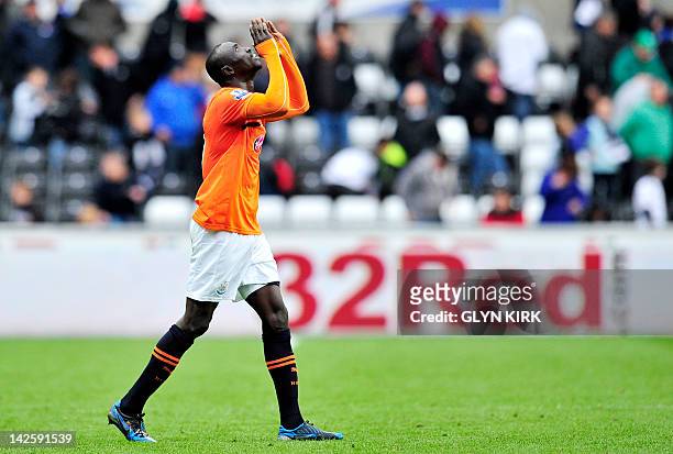 Newcastle United's Senegalese striker Papiss Cisse celebrates his team's victory during the English Premier League football match between Newcastle...
