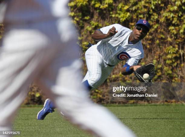 Alfonso Soriano of the Chicago Cubsmakes a diving catch against the Washington Nationals at Wrigley Field on April 8, 2012 in Chicago, Illinois.