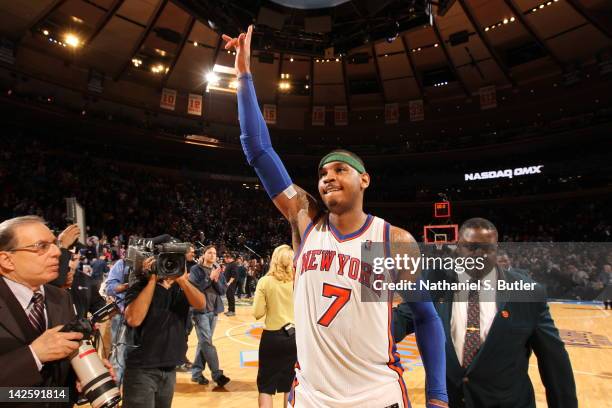 Carmelo Anthony of the New York Knicks, who has hit two last second shots to win in overtime, celebrates victory during the game between the Chicago...