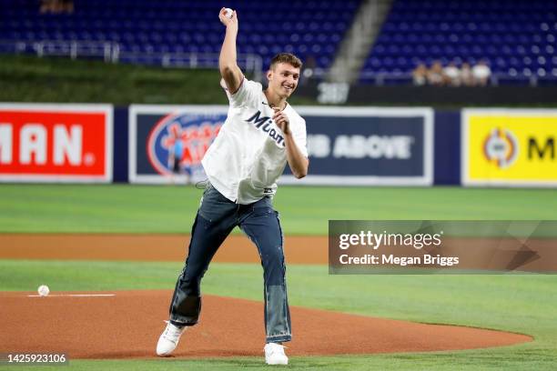 Miami Heat first round draft pick Nikola Jovic throws the first pitch prior to a game between the Chicago Cubs and Miami Marlins at loanDepot park on...
