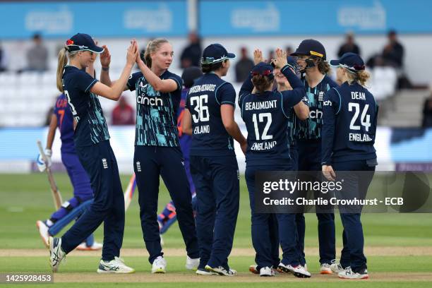 Freya Kemp of England celebrates with team mates after taking the wicket of India's Pooja Vastrakar during the 2nd Royal London ODI between England...