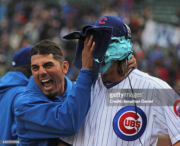 Matt Garza of the Chicago Cubs smears shaving cream into the face of pitcher Jeff Samardzija after a win against the Washington Nationals at Wrigley...