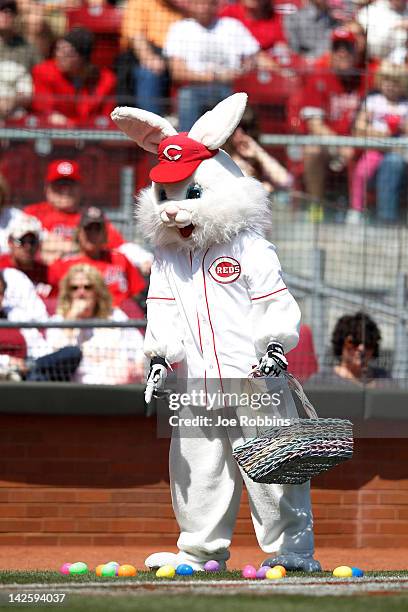 The Easter Bunny drops eggs on the field in between innings of the game between the Cincinnati Reds and Miami Marlins at Great American Ball Park on...