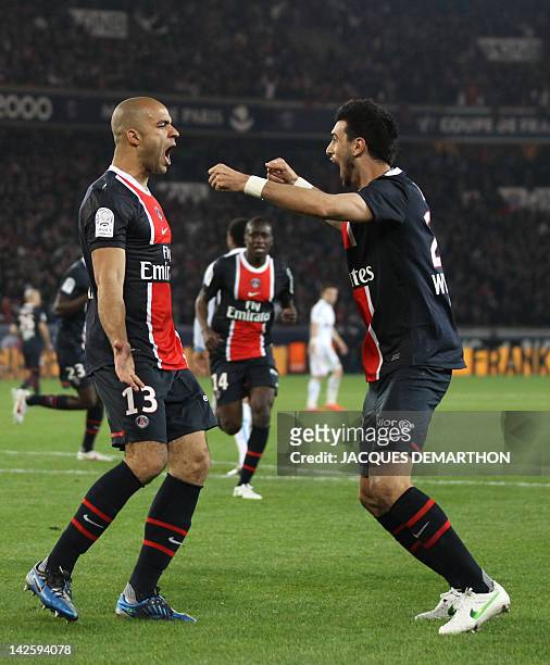S defender Alex Rodrigo Dias da Costa celebrates with teammate, midfielder Javier Pastore after he scored a goal during the French L1 football match...