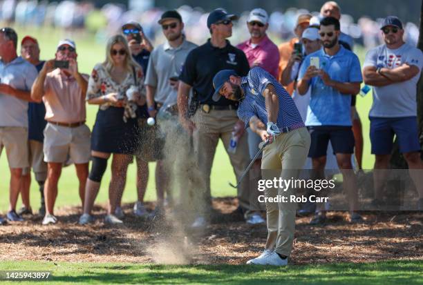 Cameron Young of the United States Team plays a second shot on the second hole as fans look on during a practice round prior to the 2022 Presidents...