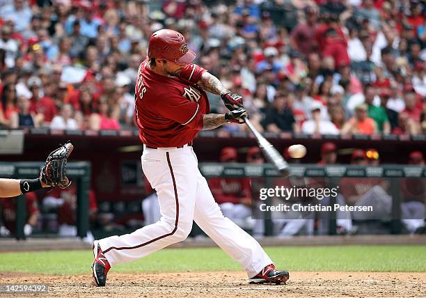 Ryan Roberts of the Arizona Diamondbacks hits a two-run home run against the San Francisco Giants during the sixth inning of the MLB game at Chase...