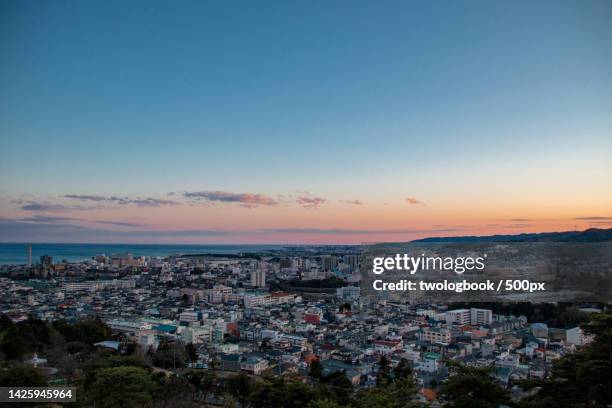 high angle view of townscape against sky at sunset,hitachi,ibaraki,japan - ibaraki prefecture photos et images de collection