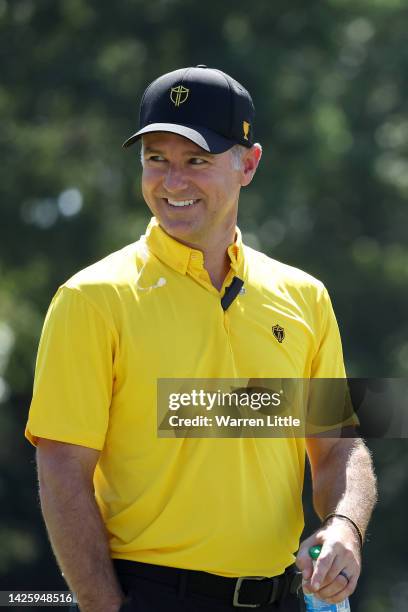 Captain Trevor Immelman of the International Team looks on during a practice round prior to the 2022 Presidents Cup at Quail Hollow Country Club on...