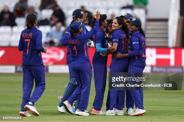 Renuka Singh Thakur of India celebrates with team mates after taking the wicket of India's Emma Lamb during the 2nd Royal London ODI between England...