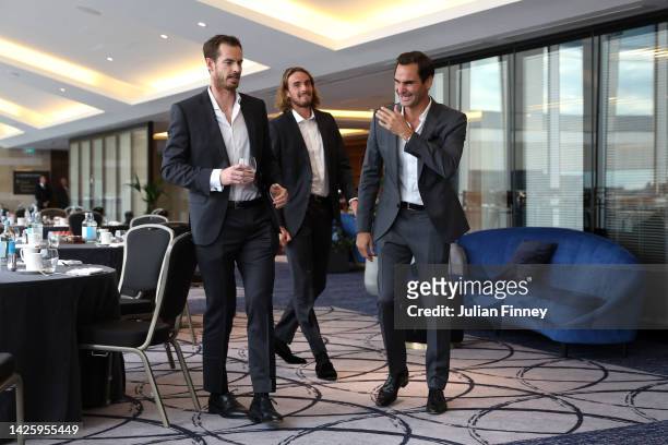 Roger Federer, Andy Murray and Stefanos Tsitsipas of Team Europe share a joke as they prepare for a photoshoot on September 21, 2022 in London,...