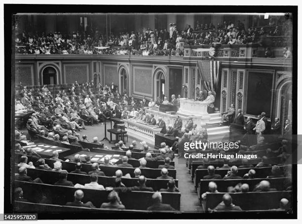 Woodrow Wilson Addressing Congress, between 1910 and 1917. President of the United States. Women permitted to watch from the public gallery. In...