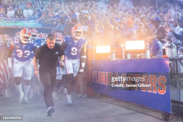 Head coach Billy Napier of the Florida Gators takes the field with his team before a game against the South Florida Bulls at Ben Hill Griffin Stadium...