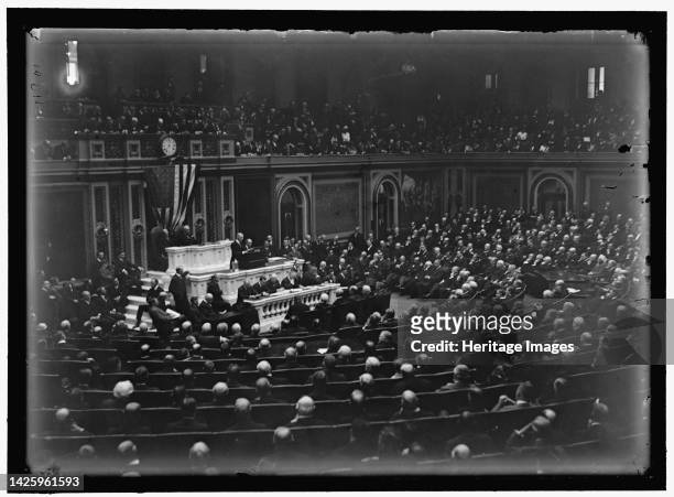 Woodrow Wilson before Congress, between 1913 and 1918. President of the United States. Women permitted to watch from the public gallery. In November...