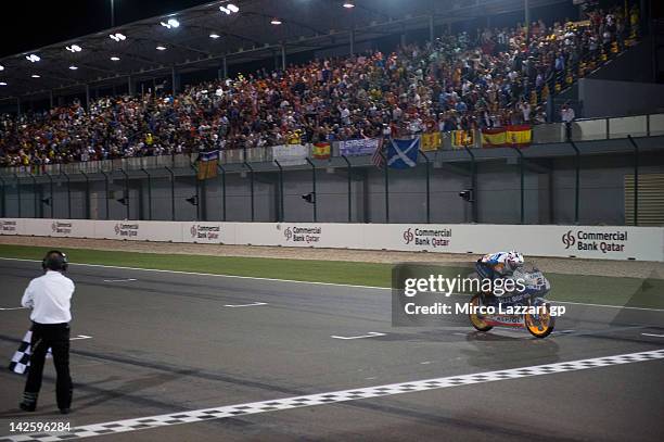 Maverick Vinales of Spain and Avintia Racing Moto3 cuts the finish lane at the end of the Moto3 race of MotoGP of Qatar at Losail Circuit on April 8,...