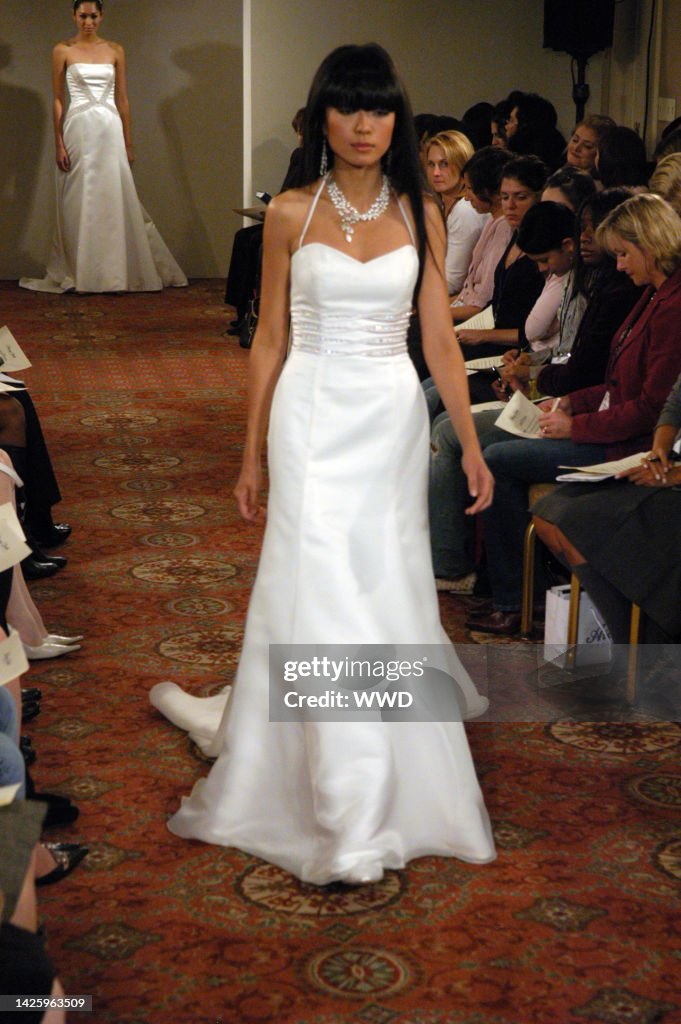 Henry Roth Pulls A model on the runway at Henry Roth\'s fall 2006 bridal show. News ...