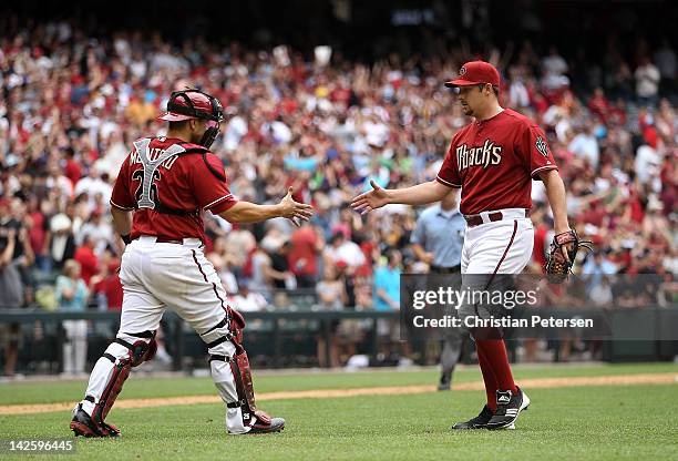 Relief pitcher Bryan Shaw of the Arizona Diamondbacks celebrates with catcher Miguel Montero after defeating the San Francisco Giants in the MLB game...
