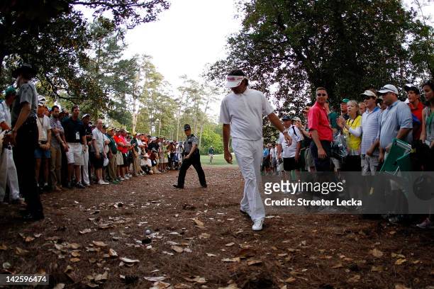 Bubba Watson of the United States looks at a shot from the rough on second sudden death playoff hole on the 10th during the final round of the 2012...